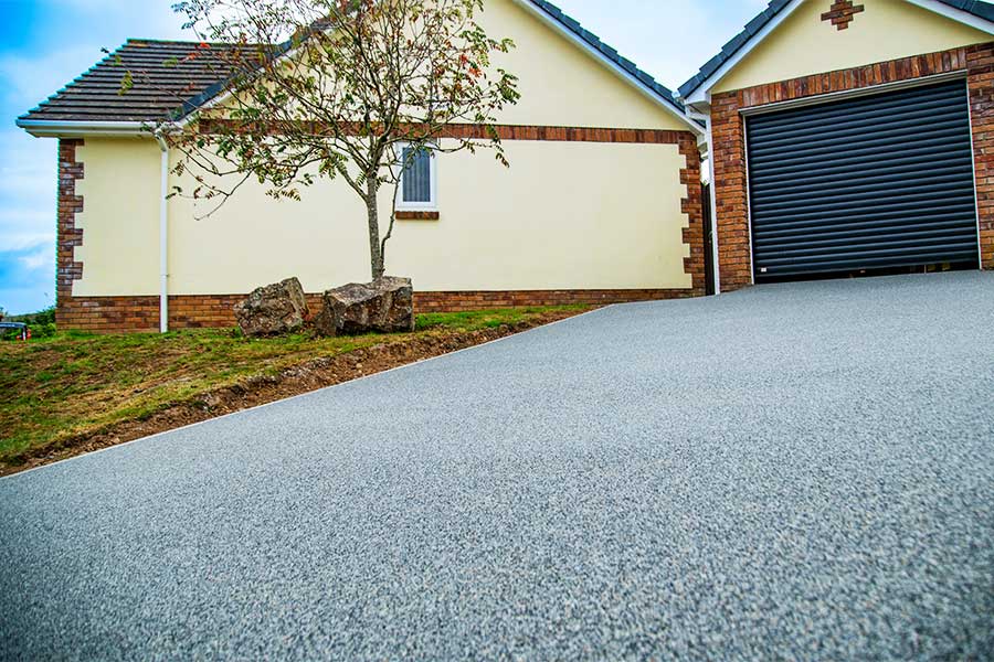 Resin bound gravel used for a sloping drive where lose gravel would migrate down hill