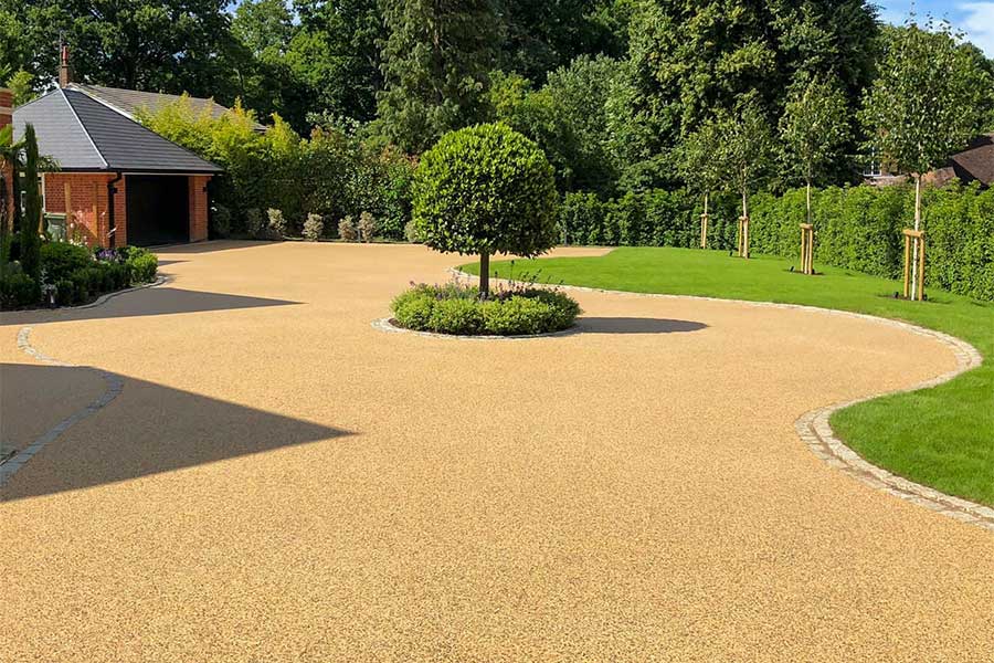 Large resin bound driveway covered with AddaGrip Stonebound resin bound gravel in honey colour