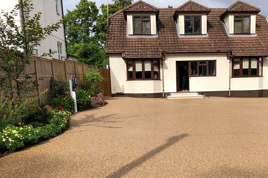 Large driveway covered with Nevada Sand coloured resin bound gravel as an alternative to asphalt