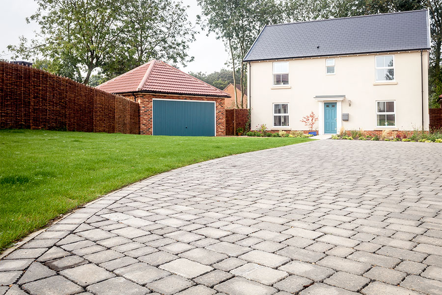 Large detached house with silver block paved driveway