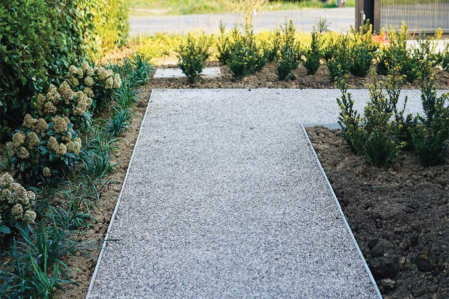 Neat grey gravel path created using Core Path Pro gravel stabilising grids