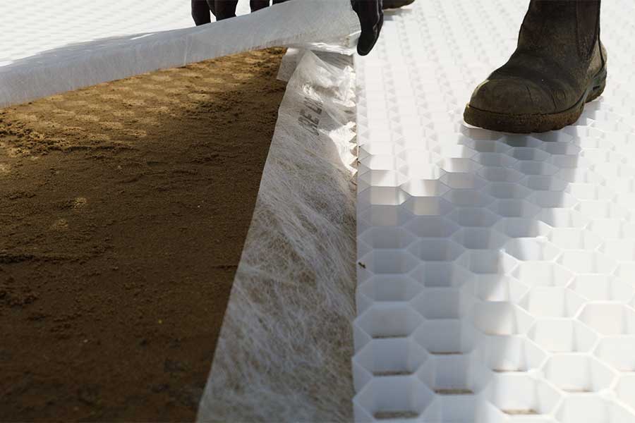 Driveway specialist installing Core Drive gravel stabilising grids before filling with gravel