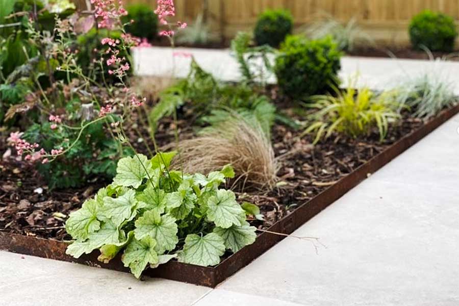 Neat garden border with corten steel metal garden edging