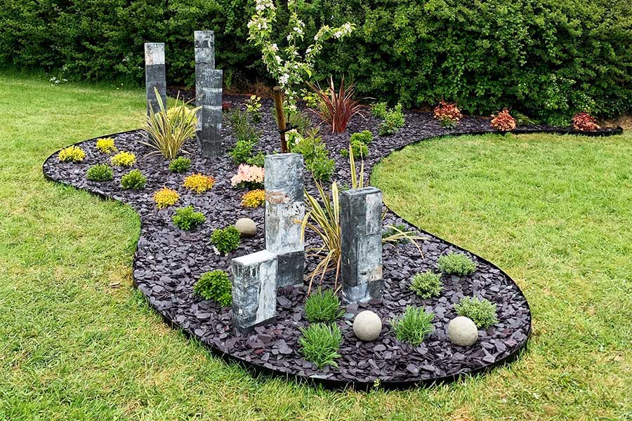 Large sculptured garden border created using corten steel garden edging