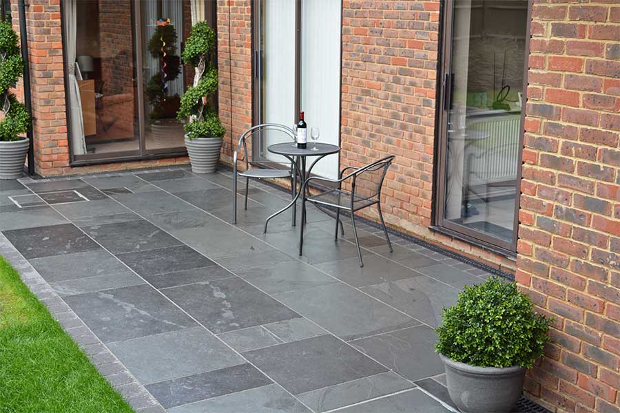 Modern patio featuring AWBS Exclusive Brazilian Slate paving slabs in a random patteren