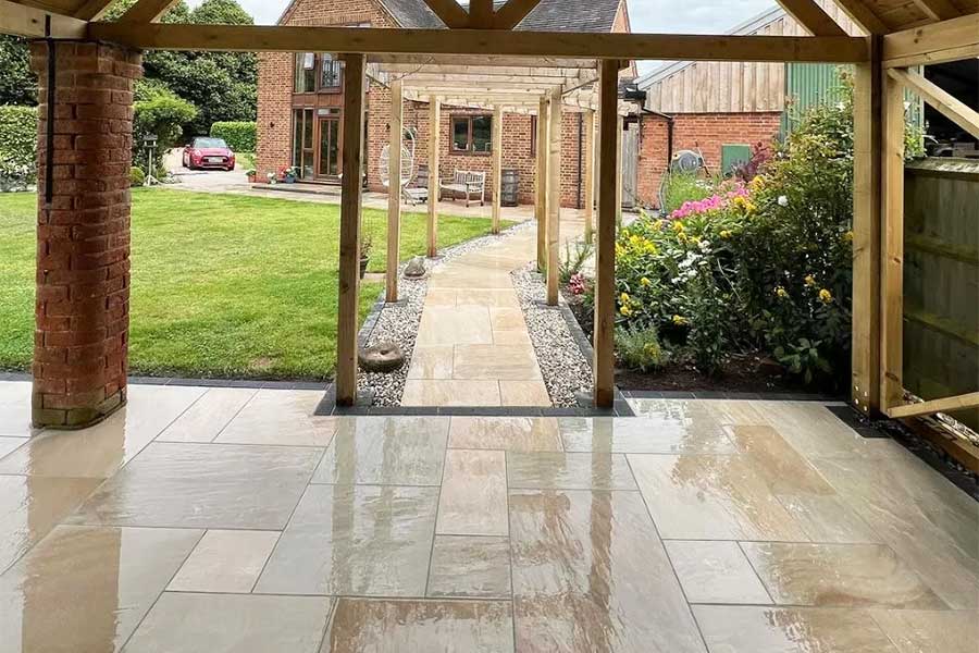 AWBS Meadow Blend Indian sandstone effect porcelain paving used for a large garden patio