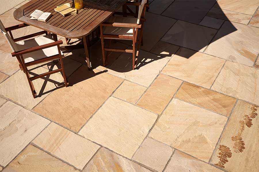 Patio paved with AWBS Desert sandstone paving with yellow and cream tones