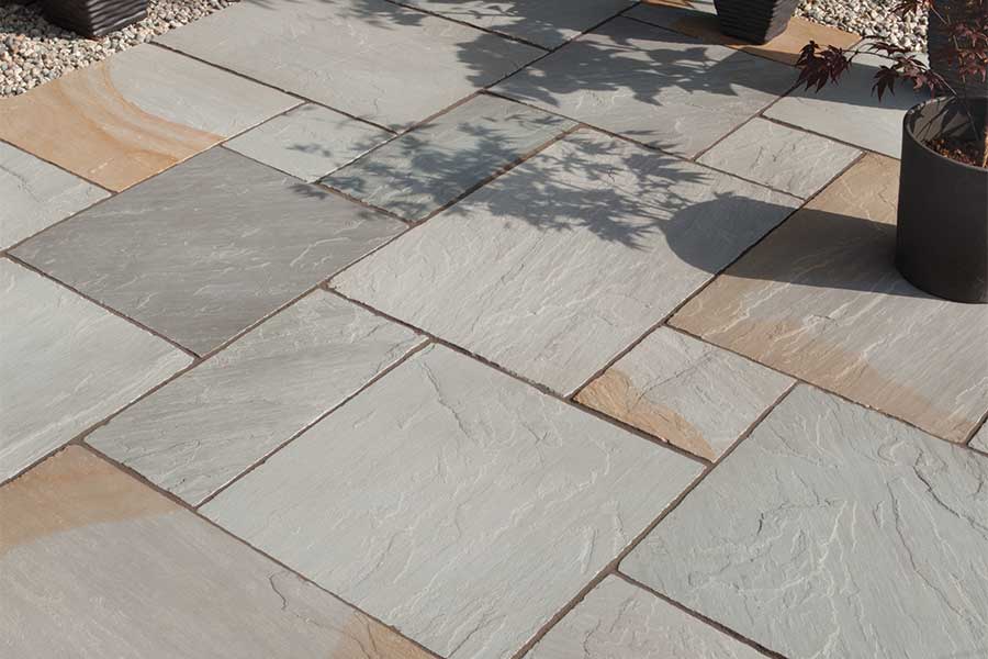 Lovely patio with AWBS Hinksey Blend grey natural stone paving with orange and red highlights