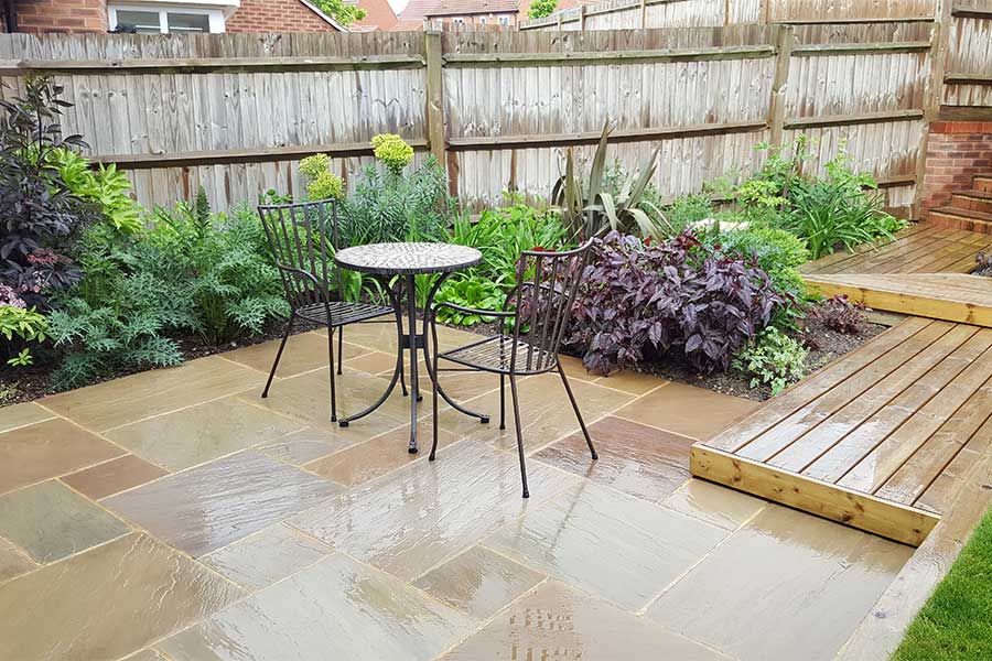 New patio paved with AWBS Exclusive Meadow Blend sandstone paving slabs